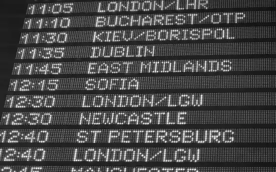 A departures board, rows of times beside the places they leave for.